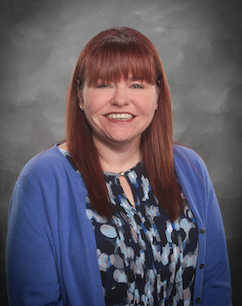 A portrait of a smiling woman